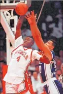  ?? ERIC RISBERG/ THE ASSOCIATED PRESS FILE PHOTO ?? Former UNLV basketball star Larry Johnson (4) goes in for a dunk against Duke’s Alaa Abdelnaby in the 1990 NCAA title game.