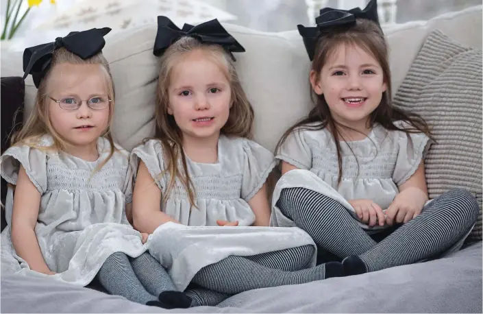  ??  ?? Thrice as nice: Non-identical triplets Charlotte, Elizabeth and Emily who are now four. Their delighted mother describes the girls as her ‘three little miracles’