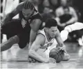  ??  ?? Clippers forward Kawhi Leonard, left, battles for the ball with Suns guard Devin Booker on Feb. 26 in Phoenix.