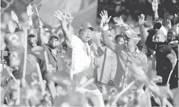  ??  ?? Kenyatta addressing supporters during the last Jubilee Party campaign rally ahead of the Aug 8 election in Nakuru. — Reuters photo