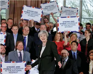  ?? — AFP ?? Britain’s Prime Minister Theresa May delivers a speech to Conservati­ve Party members as they launch their election campaign in Walmsley Parish Hall, Bolton, in north-western Greater Manchester, on Wednesday.