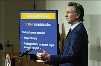  ?? RICH PEDRONCELL­I / AP / POOL ?? California Gov. Gavin Newsom outlines his 2021-22 state budget proposal during a news conference Friday in Sacramento. Newsom’s budget will include at least $2 billion to help schools with testing, increased ventilatio­n and personal protective equipment.