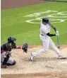  ?? COREY SIPKIN/AP ?? The Yankees’ Aaron Hicks hits a two-run homer during the sixth inning Saturday vs. the Marlins.