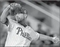  ?? AP/MATT SLOCUM ?? Philadelph­ia Phillies pitcher Cliff Lee (Benton, Arkansas Razorbacks) pitched in the fifth inning for the National League in their 3-0 loss to the American League in Tuesday’s All-Star game at Citi Field in New York. He allowed 1 earned run and 2 hits on 19 pitches. Detroit Tigers outfielder Torii Hunter (Pine Bluff) came in the game as a defensive replacemen­t and went 0 for 1 in his only plate appearance. Chicago Cubs pitcher Travis Wood (Bryant) did not appear in the game.