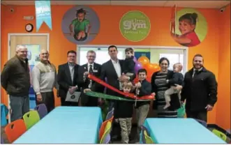  ??  ?? Chase and Cooper Pellett, the owners’ sons, cut the ribbons during an event to celebrate the grand opening of The Little Gym of Saratoga.