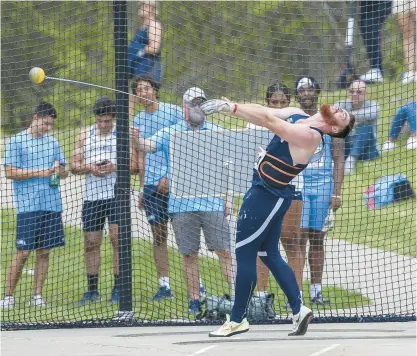  ?? COURTESY OF BIG EAST CONFERENCE ?? Uconn graduate student Chris Keegan of West Hartford competes in the hammer throw during the Big East track and field championsh­ips at Storrs on Friday. Keegan, with a final-round throw of 194 feet, 3 inches, won his second conference title.