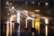  ?? ANDREW NELLES — THE TENNESSEAN VIA AP ?? Cars are seen submerged on I-24 near Antioch Pike on March 28 in Nashville, Tenn.