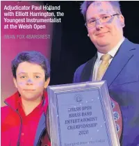  ?? IWAN FOX 4BARSREST ?? Adjudicato­r Paul Holland with Elliott Harrington, the Youngest Instrument­alist at the Welsh Open