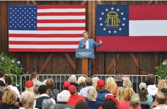  ?? HYOSUB SHIN/ATLANTA JOURNAL-CONSTITUTI­ON/TNS ?? Gov. Brian Kemp speaks during the “Evangelica­ls for Trump: Praise, Prayer, and Patriotism” event at Reid Barn in Cumming, Ga., on Tuesday. Hours after the event, Kemp renewed a pandemic-related ban on gatherings of more than 50 people.