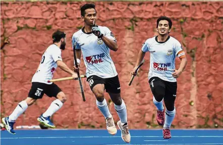  ??  ?? Confident: Terengganu forward Faizal Saari (centre) said his teammates were all fired up to tear UniKL apart in the TNB Cup semi-finals first-leg match at the National Hockey Stadium in Bukit Jalil today.