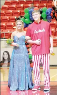  ??  ?? Junior maid Siana Sisemore, daughter of John and Lori Sisemore, escorted by James Payne, son of Michael and Melissa Payne.