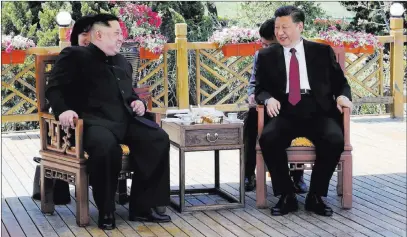  ?? Ju Peng ?? The Associated Press Chinese President Xi Jinping speaks with North Korean leader Kim Jong Un in China’s Liaoning Province on Monday or Tuesday. Meanwhile, Secretary of State Mike Pompeo arrived in North Korea on Wednesday, and Japan hosted to a...