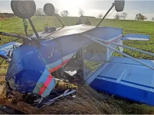  ?? Northumber­land Fire and Rescue Service ?? > The plane finished up on its roof in the field