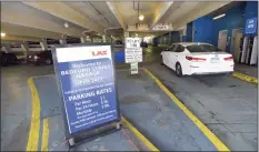  ?? Matthew Brown / Hearst Connecticu­t Media ?? A car enters the Bedford Street Garage in Stamford on July 9. Fewer consumers and workers in downtowns have led to a drop in parking revenue in Connecticu­t cities, forcing some to cut hours for staff.