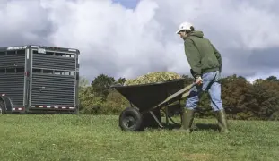  ??  ?? A wheelbarro­w has many uses and can be used in different situations around the farm, garden and pasture.