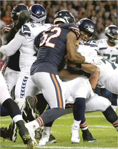  ?? DAVID BANKS/AP ?? Bears linebacker Khalil Mack sacks Seahawks quarterbac­k Russell Wilson in the first half Monday at Soldier Field.