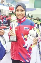  ??  ?? Andi Azura wins Sabah’s 29th gold from in the 19th Sukma women’s Pencak Silat Class D (60-65kg) final yesterday.