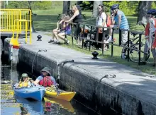  ?? CLIFFORD SKARSTEDT/ EXAMINER ?? A pair of kayakers wait to go through Lock 20 at Maria St. on Wednesday along the Trent-Severn Waterway. The federal government is reviewing the changes that were implemente­d in 2014 to the Navigation Protection Act.