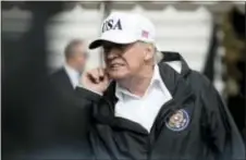  ?? ANDREW HARNIK — THE ASSOCIATED PRESS ?? President Donald Trump takes a question from a member of the media on the South Lawn of the White House in Washington, Thursday after meeting with people impacted by Hurricane Irma in Florida.