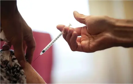  ?? — AFP photo ?? A woman receives a dose of the Pfizer-BioNTech vaccine against the coronaviru­s at the Clermont-Tonnerre military hospital (HIA) in Brest, western France, on April 6, 2021, during a vaccinatio­n campaign to fight the Covid-19 pandemic.