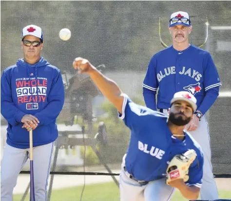  ?? NATHAN DENETTE/THE CANADIAN PRESS ?? New Toronto Blue Jays manager Charlie Montoyo and pitching coach Pete Walker watch Hector Perez work out as the team kicks off spring training this week in Dunedin, Fla. The Jays will trot out a young lineup this season with several veterans having moved on.