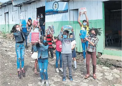  ?? FOTOS: MARVIN SALGADO ?? Este pequeño grupo de estudiante­s mostraron contentos los cuadernos que recibieron para continuar sus estudios y escribir en ellos los primeros peldaños para alcanzar sus sueños.