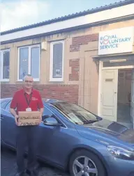  ??  ?? Door to door Royal Voluntary Service volunteer Peter Adamson before he sets out