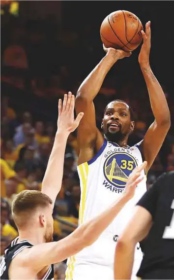 ?? AP ?? Golden State Warriors’ Kevin Durant (35) shoots over San Antonio Spurs’ Davis Bertans during the first quarter in Game 5 of the first-round NBA play-off series on Tuesday.