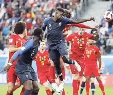  ?? FILE ?? France’s Samuel Umtiti (No. 5) heads the ball to score the only goal of the game during the semi-final match against Belgium at the 2018 World Cup in Russia on July 10.