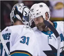  ?? BOB FRID — USA TODAY SPORTS ?? Sharks forward Joe Thornton congratula­tes goalie Martin Jones after a 7-2rout of host Vancouver Monday — the team’s sixth win in a row.