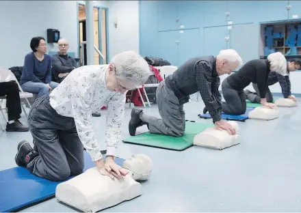  ?? PHOTOS: GRAHAM HUGHES ?? Beverley Shaver, left, and husband Marvin Shaver, centre, learn CPR at the Beaconsfie­ld Recreation Centre on Monday. Two more Hero in 30 workshops are scheduled for this month.