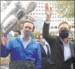  ?? Ned Gerard / Hearst Connecticu­t Media ?? U.S. Sen. Chris Murphy, left, and Gov. Ned Lamont wave to patients during a thank you rally in front of Northbridg­e Health Care Center in Bridgeport on May 1.