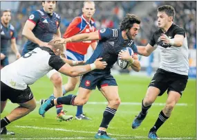  ?? Picture: GETTY IMAGES ?? FRENCH CONNECTION: Maxime Machenaud of France, with the ball, and Beauden Barrett of New Zealand, far right, in action during the Test match between France and the All Blacks at Stade de France on Saturday. The visitors won 24-19