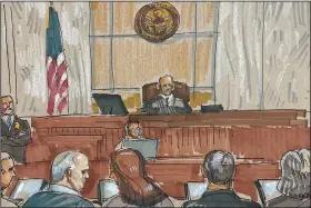  ?? (AP/David Klug) ?? In this courtroom sketch, Robert Bowers, the suspect in the 2018 synagogue massacre, confers with his legal team on Tuesday in Pittsburgh.