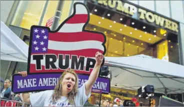  ?? REUTERS ?? A supporter shouts slogans on Saturday outside Trump Tower in Manhattan, New York, where Donald Trump lives.