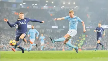  ??  ?? Manchester City’s Kevin De Bruyne scores their second goal during the English Premier League football match between Manchester City and Tottenham Hotspur at the Etihad Stadium in Manchester, north west England. — Reuters photo