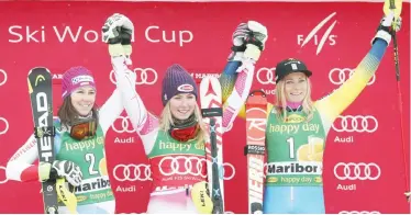  ??  ?? MARIBOR: From left, Switzerlan­d’s Wendy Holdener, second placed, Mikaela Shiffrin, the winner, of the United States, and Sweden’s Frida Hansdotter, third placed, celebrate on podium after an alpine ski, women’s World Cup slalom in Maribor, Slovenia,...