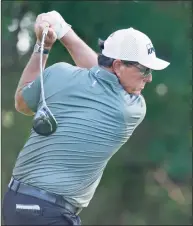  ?? Ron Jenkins / Associated Press ?? Phil Mickelson plays his shot from the 12th tee during the first round of the Charles Schwab Challenge golf tournament at the Colonial Country Club in Fort Worth, Texas on May 27.