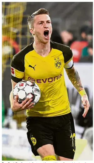  ?? — AFP ?? Deadly strike: Borussia Dortmund forward Marco Reus celebratin­g after scoring against Bayern Munich during the Bundesliga match on Saturday.