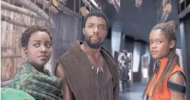  ?? DISNEY/ASSOCIATED PRESS ?? Lupita Nyong’o, from left, Chadwick Boseman and Letitia Wright in a scene from “Black Panther.” The cast was nominated for a SAG Award for best ensemble.