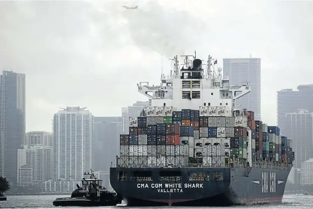  ?? Picture: Joe Raedle/Getty Images/AFP ?? A cargo ship prepares to dock at Port Miami in Florida this week as the US and China continue their trade war. Last year China was the top trading country for the port.