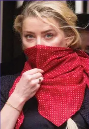  ??  ?? Lady in red: Amber Heard arrives at ex Johnny Depp’s libel trial in a bandana