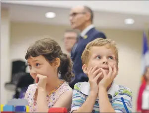  ?? CP PHOTO ?? Bryson Boyce-Pettes, 5, right, and Eleonore Alamillo-Laberge, 6, take part in a press conference as Social Developmen­t Minister Jean-Yves Duclos and P.E.I. Minister of Education Doug Currie speak as federal-provincial and territoria­l ministers...