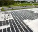  ?? DANA JENSEN THE DAY ?? The solar panels are located on the roof of the second floor of Groton Middle School. In the background is the school’s sports field that has new LED lights.