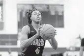  ?? GREGORY PAYAN/AP ?? University School’s Scot Barnes shoots a free throw against Montverde in a boys quarterfin­al game at the GEICO High School Basketball Nationals in New York City on April 4.