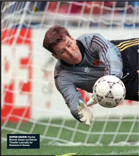  ??  ?? SUPER SAVER: Packie Bonner keeps out Daniel Timofte’s penalty for Romania in Genoa