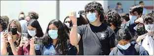  ?? ALEX HORVATH / THE CALIFORNIA­N ?? South High School students wear masks on a recent day as they attended an assembly after school. Mask requiremen­ts remain in effect in California despite a CDC announceme­nt that mask wearing had been relaxed for people who have been vaccinated.