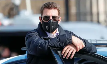  ??  ?? The real Tom Cruise, on the set of Mission Impossible 7 in Rome last year. Photograph: Guglielmo Mangiapane/Reuters