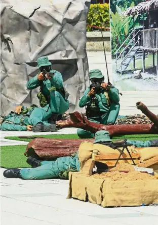  ?? — Bernama ?? History brought to life: Performers re-enacting a dramatic moment to show the audience what happened during ‘Ops Iblis’. The operation was a special reconnaiss­ance mission to track down a group of communist terrorists in the jungles near Ulu Kinta, Perak, on June 3, 1971.