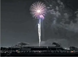  ?? JOHN J. KIM/CHICAGO TRIBUNE ?? Fireworks explode over SeatGeek Stadium at the Bridgeview Park District’s drive-up event Friday.